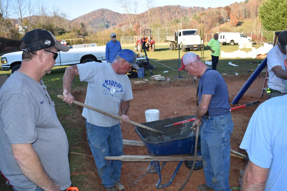 Madison County Schools' maintenance supervisor Andy Gregg, second from left, said he is seeking volunteers to help install Hot Springs Elementary's playground set. The project will start Dec. 6.