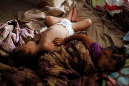 Krystle Jackson's children, Kavon Jackson, 1, and Kaydance Jackson, 3, sleep in their parents house in Cedar Lake, Indiana, U.S. September 16, 2016. REUTERS/Michelle Kanaar