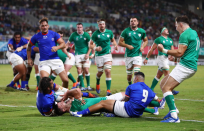 The pain and the glory...The aftermath of a daring lunge for the line sees Johnny Sexton lying prone on the ground after scoring Ireland’s fourth try in a 47 - 5 win. Photographer Michael Steele (Getty Images) says: “This was shot on a 70-200mm lens which was perfect to show Jonny Sexton of Ireland celebrating after scoring his second try of the game.”