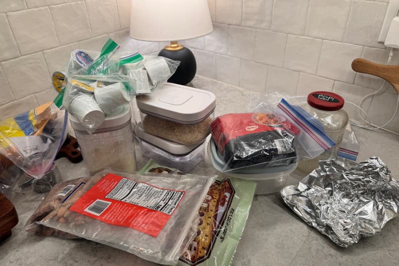 Contents of pantry on countertop during organizing project.