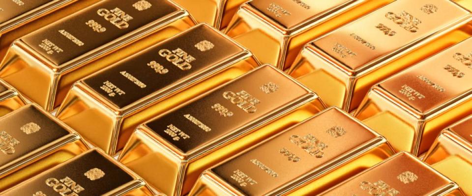 Pure gold bullion bars in bank vault storage.