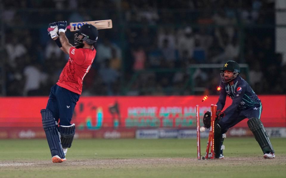 The England captain's wild heave connected with nothing but air - Anjum Naveed/AP