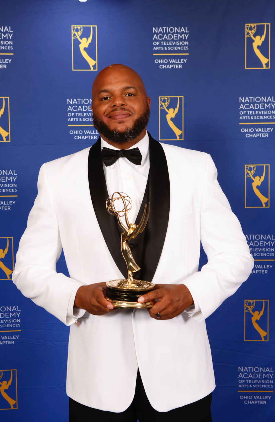 Devine Carama holds his Emmy at the 2022 Ohio Valley Regional Emmy Awards on Saturday, July 30, 2022.