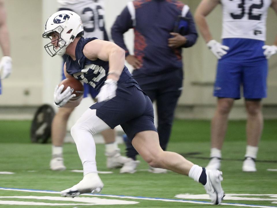 BYU receiver Hobbs Nyberg runs with the ball during practice in the Indoor Practice Facility at BYU in Provo on Monday, Feb. 28, 2022. According to OC Aaron Roderick, Nyberg, along with Talmage Gunther, are guys he can count on. | Kristin Murphy, Deseret News