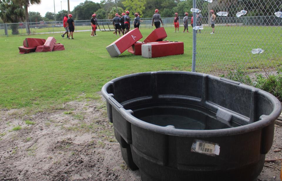 A cold-water immersion tub sits next to the football practice field at Terry Parker High School in Jacksonville, Florida on August 24, 2020. Under the Zachary Martin Act, passed earlier in 2020, schools must provide cooling zones for athletic activities to reduce the risk of heat illness. [Clayton Freeman/Florida Times-Union]