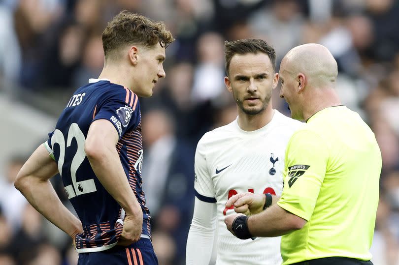 Referee Simon Hooper (right) speaks with Nottingham Forest's Ryan Yates (left) and Tottenham Hotspur's James Maddison