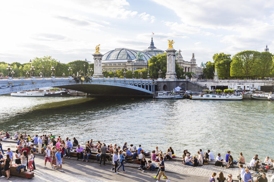 People walking along the Seine