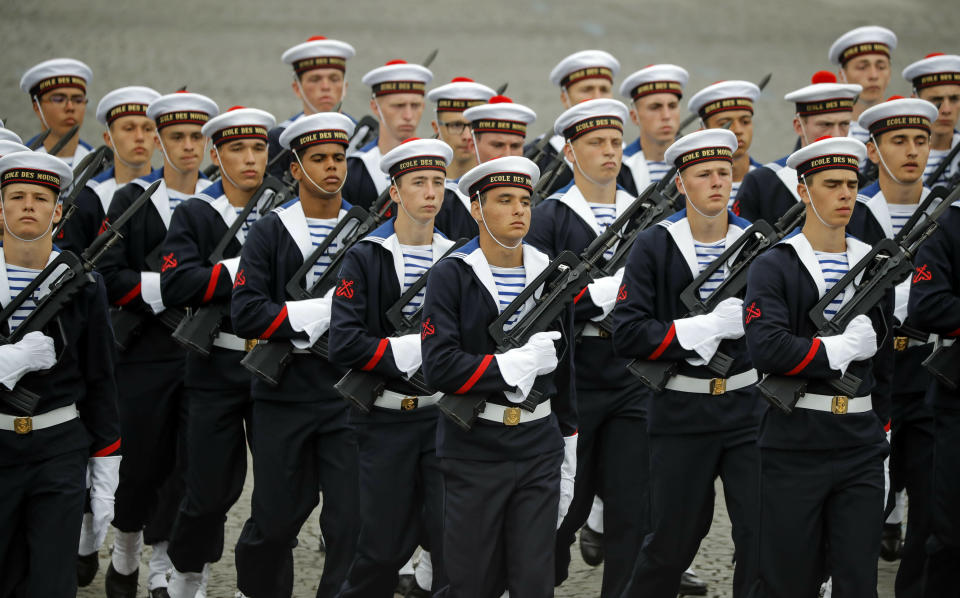 French marine cadets march on the Champs-Elysees avenue during the Bastille Day parade in Paris, France, Sunday July 14, 2019. (AP Photo/Michel Euler)