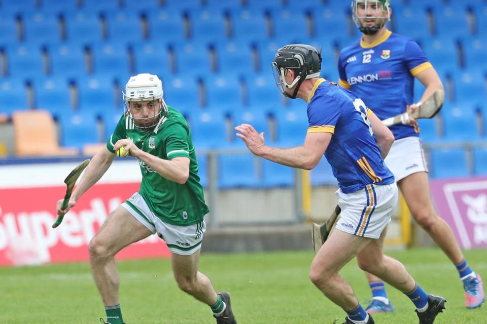 Dylan Bannon breaks free from the tackle of Oisín Gately. <i>(Image: Martin Brady)</i>