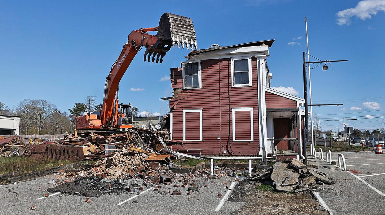 The old Assinippi General Store is demolished to make way for expansion of Merchants Row on Washington Street in Hanover on Wednesday April 24, 2024