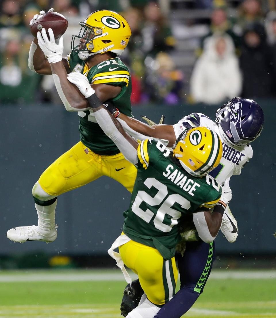 Green Bay Packers safety Adrian Amos (31) intercepts a pass in the end zone with defensive help from Green Bay Packers’ Darnell Savage (26) against Seattle Seahawks wide receiver D’Wayne Eskridge (1) during their football game on Sunday, Nov. 14, 2021, at Lambeau Field in Green Bay, Wis.<br>Cent02 7iewzauxl1d1gxjmzetz Original