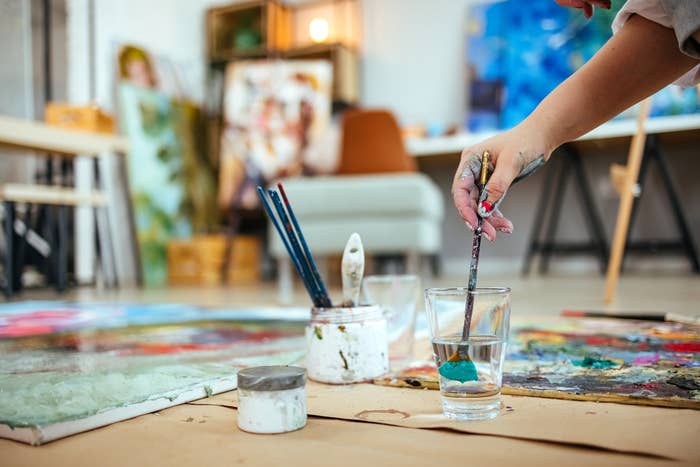 Artist in her studio in a mess