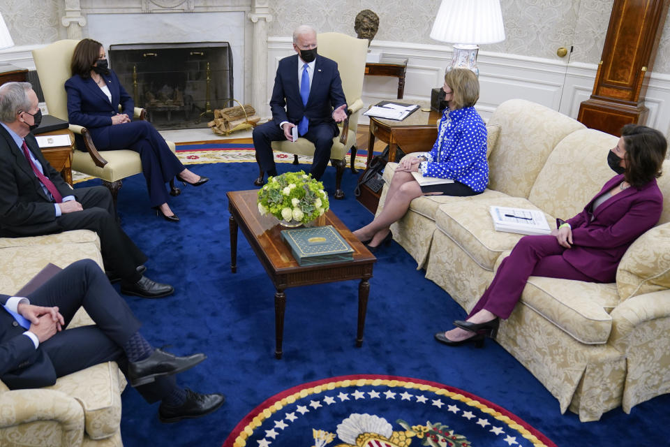 FILE - President Joe Biden speaks during a meeting in the Oval Office of the White House, May 13, 2021, in Washington. From left, Secretary of Transportation Secretary Pete Buttigieg, Sen. Mike Crapo, R-Idaho, Vice President Kamala Harris, Biden, Sen. Shelley Moore Capito, R-W.Va., and Commerce Secretary Gina Raimondo. (AP Photo/Evan Vucci, File)