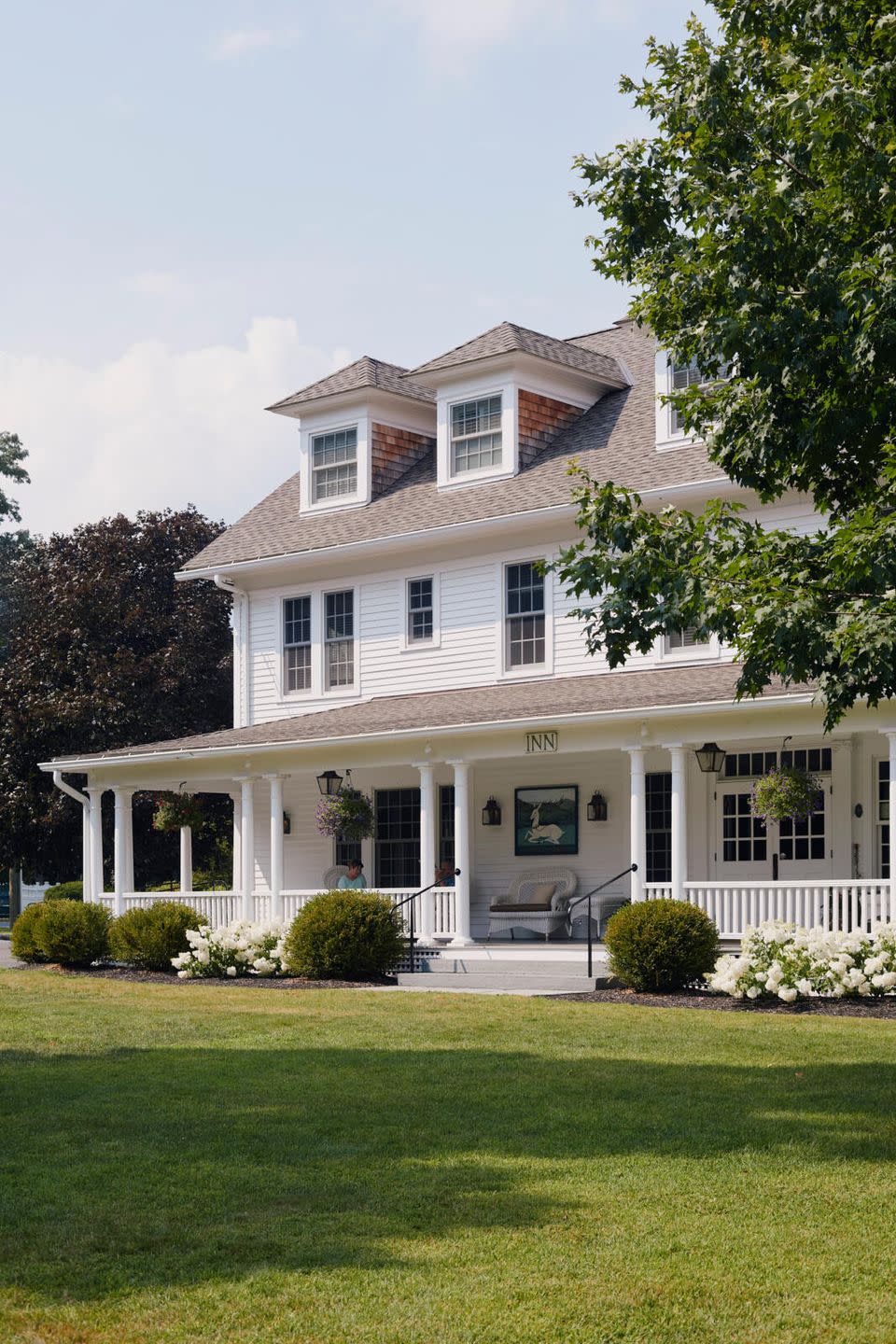 a large house with a lawn in front of it