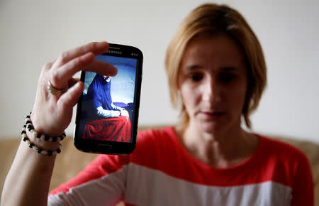 Alema Dolamic shows a picture of her sister who went to Syria, in Bedaci village, near Tesanj, Bosnia and Herzegovina, March 5, 2019. REUTERS/Dado Ruvic