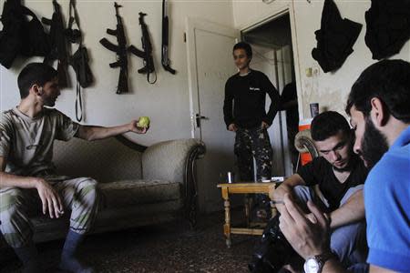 Free Syrian Army fighters rest in a safe house in Aleppo's Al-Ezaa neighbourhood, September 1, 2013. REUTERS/Malek Alshemali