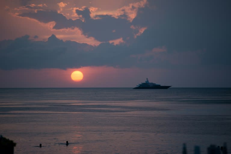 A speedboat boat carrying 32 tourists plus four crew flipped over and tossed its passengers into the sea after it was slammed by a wave near a rocky stretch of coast in the Gulf of Thailand