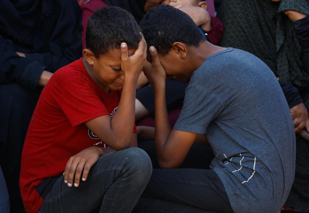 Mourners react during the funeral of Palestinians killed in Israeli strikes in Khan Younis, southern Gaza Strip 26 August 2024 (Reuters)