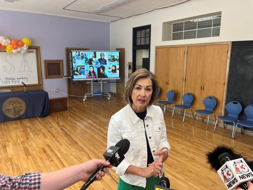 Iowa Gov. Kim Reynolds speaks to reporters Friday, May 17, 2024 at the Horizon Science Academy after signing a law directing more funding to charter schools.