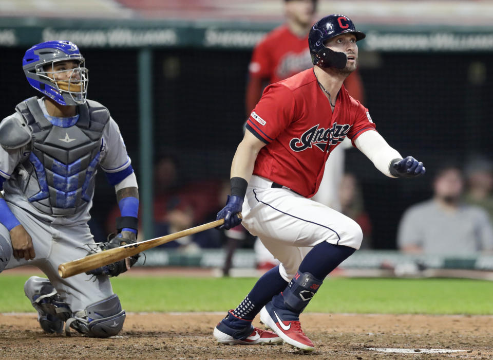 Cleveland Indians' Tyler Naquin, right, watches the ball after hitting a two-run home run in the sixth inning of a baseball game, Tuesday, June 25, 2019, in Cleveland. Jason Kipnis scored on the play. Kansas City Royals catcher Martin Maldonado watches. (AP Photo/Tony Dejak)