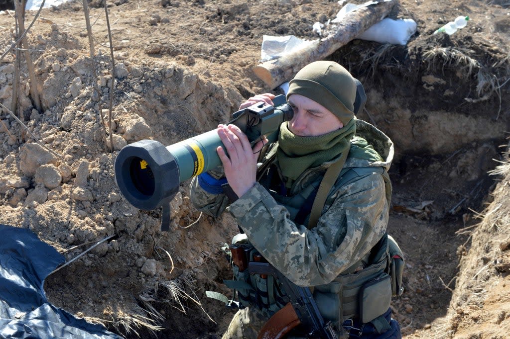 A Ukrainian military forces serviceman holds a FGM-148 Javelin, an American-made portable anti-tank missile, at a checkpoint (AFP via Getty Images)