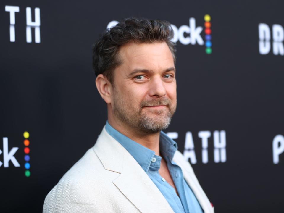 Joshua Jackson poses on the red carpet for the premiere of Peacock's "Dr. Death."