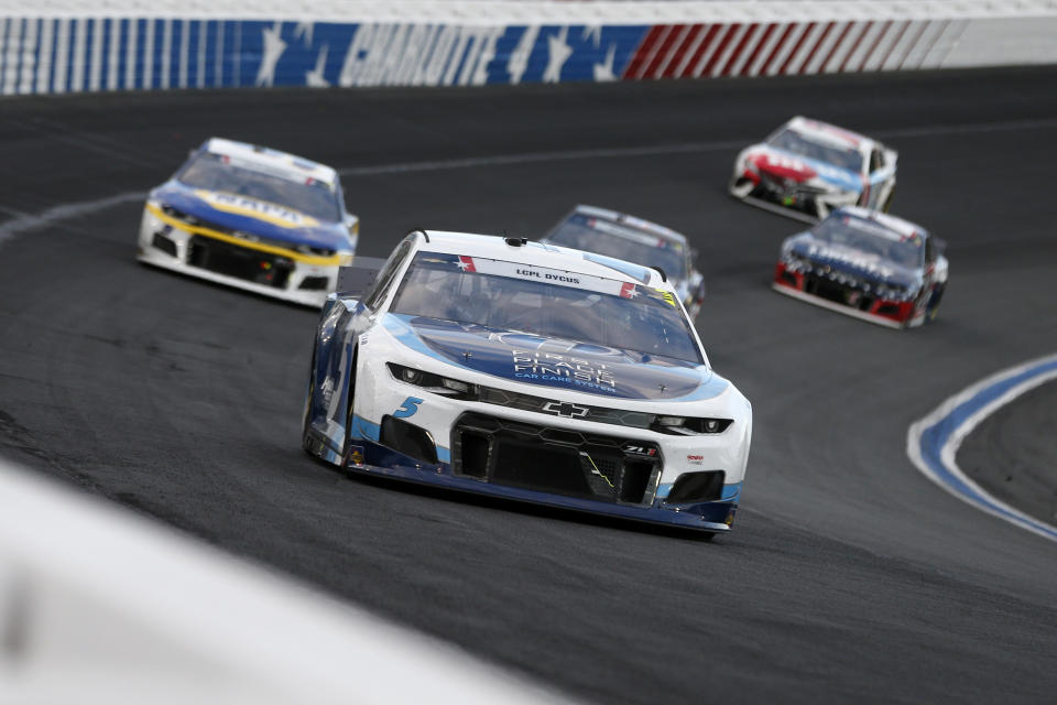 CONCORD, NORTH CAROLINA - MAY 30: Kyle Larson, driver of the #5 Metro Tech Chevrolet, leads the field during the NASCAR Cup Series Coca-Cola 600 at Charlotte Motor Speedway on May 30, 2021 in Concord, North Carolina. (Photo by Brian Lawdermilk/Getty Images)