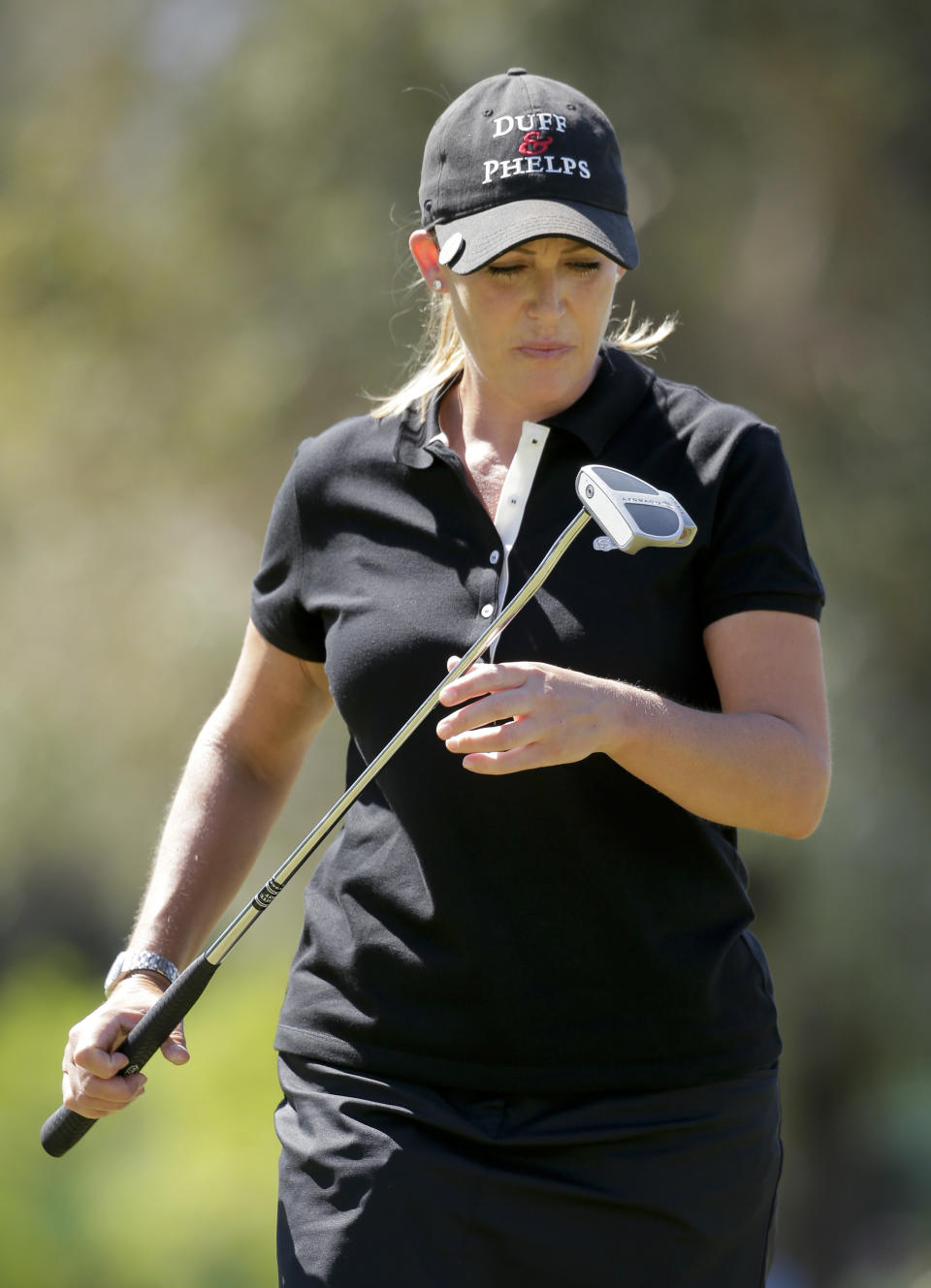 Cristie Kerr looks at her putter after missing a birdie putt on the fourth hole during the final round of the Kraft Nabisco Championship golf tournament Sunday, April 6, 2014 in Rancho Mirage, Calif. (AP Photo/Chris Carlson)