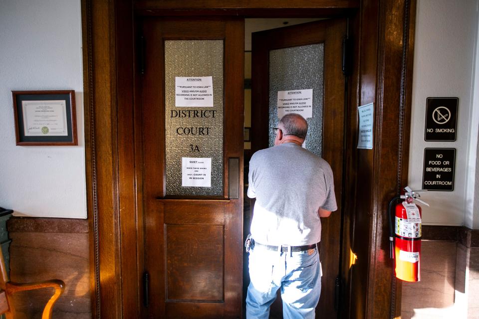 Dave Curtis, Johnson County facilities director, opens a door to courtroom 3A on Friday at the courthouse in Iowa City. The building is in the midst of a five-phase renovation.