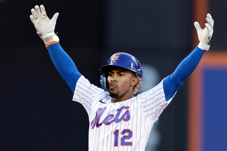 New York Mets' Francisco Lindor reacts after hitting an RBI double against the Los Angeles Dodgers during the sixth inning of a baseball game Thursday, Sept. 1, 2022, in New York.