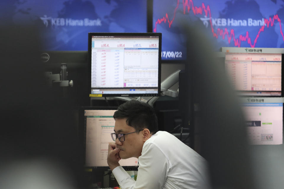 A currency trader watches monitors at the foreign exchange dealing room of the KEB Hana Bank headquarters in Seoul, South Korea, Monday, Oct. 7, 2019. Asian shares were mixed Monday, following a healthy report on U.S. jobs, while investors cautiously awaited the upcoming trade talks between the U.S. and China. (AP Photo/Ahn Young-joon)