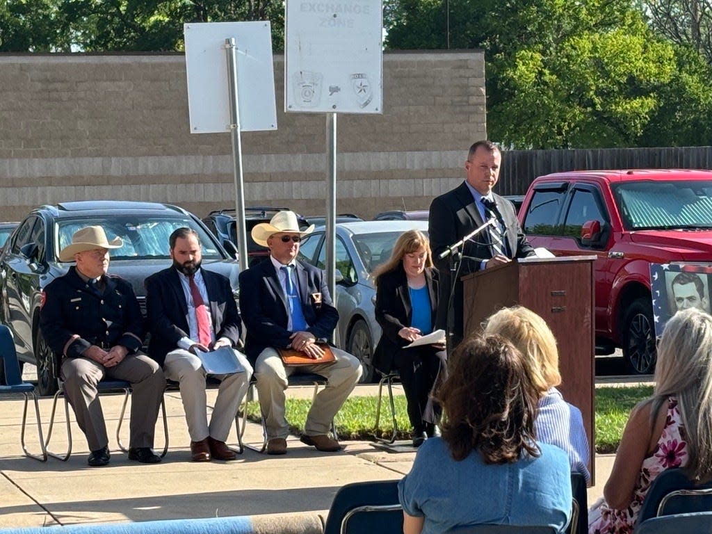 Abilene Police Chief Ron Seratte looks to family members of fallen Taylor County law enforcement officers, offering condolences and support at the annual memorial ceremony Wednesday. Seratte commended the officers' courage to answer the call of duty and acknowledged their unique stories of impact and service to the community.