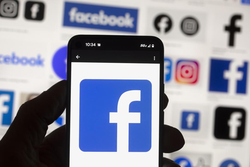 FILE - The Facebook logo is seen on a cell phone, Friday, Oct. 14, 2022, in Boston. Google, Facebook, TikTok and other Big Tech companies operating in Europe are facing one of the most far-reaching efforts to clean up what people encounter online. (AP Photo/Michael Dwyer, File)