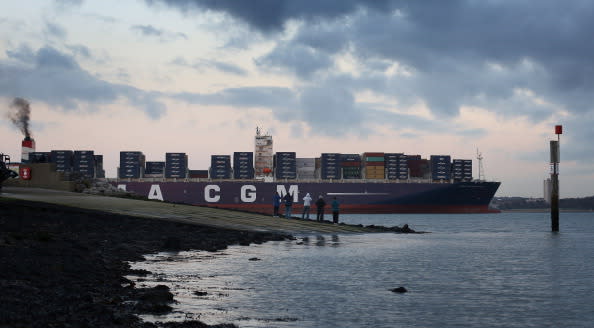 SOUTHAMPTON, ENGLAND - DECEMBER 10: People watch from the jetty at Hythe Marina as The Marco Polo, the world's biggest container ship, leaves Southampton docks on December 10, 2012 in England. On its first visit to Europe, the 54m (177ft) wide and 396m (1299ft) long container ship - which is 51m (167ft) longer than the Queen Mary II - will mostly carry consumer goods for delivery to shops for Christmas. (Photo by Peter Macdiarmid/Getty Images)