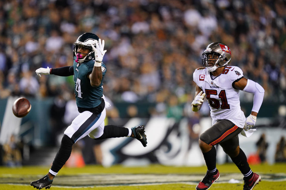 Philadelphia Eagles running back Kenneth Gainwell (14) misses a pass in front of Tampa Bay Buccaneers linebacker Kevin Minter (51) during the first half of an NFL football game Thursday, Oct. 14, 2021, in Philadelphia. (AP Photo/Matt Rourke)