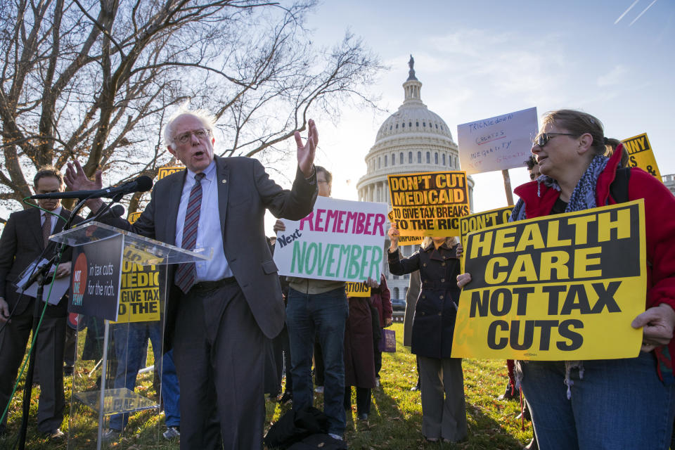 <p>Sen. Bernie Sanders joins protesters outside the Capitol as Republicans in the Senate work to pass their sweeping tax bill, a blend of generous tax cuts for businesses and more modest tax cuts for families and individuals, on Capitol Hill in Washington, Thursday, Nov. 30, 2017. (Photo: J. Scott Applewhite/AP) </p>