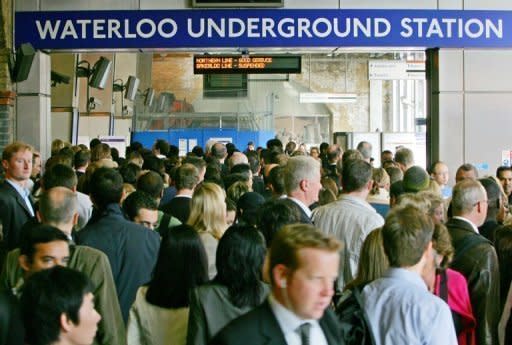 Passengers jostling to enter Waterloo underground station in central London. London's roads and ageing underground train network are already overcrowded, and many doubt fans, athletes, officials and journalists will be able to get to the Olympics without bringing the rest of the capital grinding to a halt