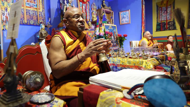 Lama Thupten Gyaltsen Dorje Rinpoche talks with practitoners at the Urgyen Samten Ling Tibetan Buddhist Temple as they participate in Prayers for Compassion in Salt Lake City on Thursday, July 13, 2023.