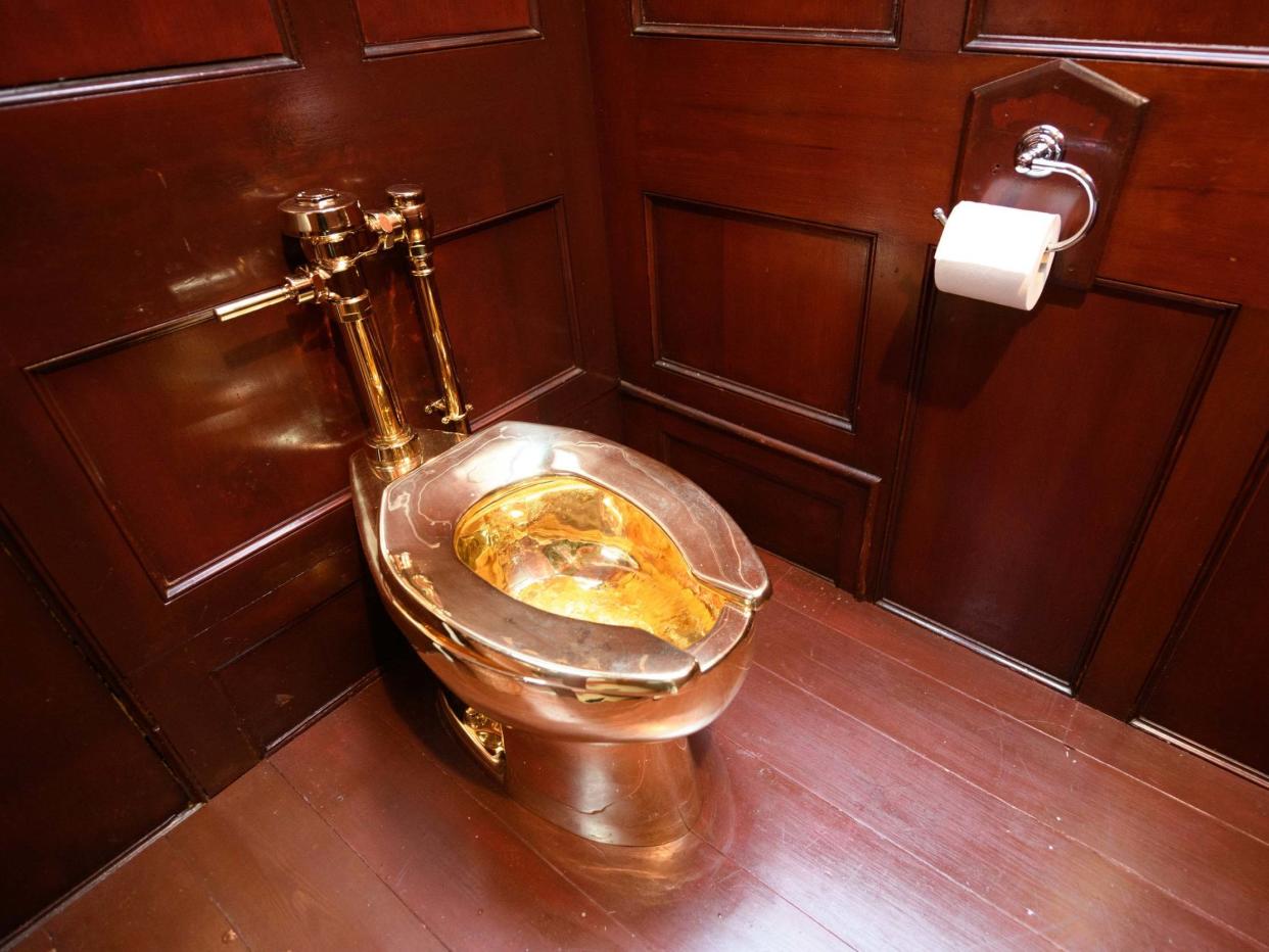 The solid gold toilet, which was fulling working, was created by Italian artist Maurizio Cattelan: Getty Images