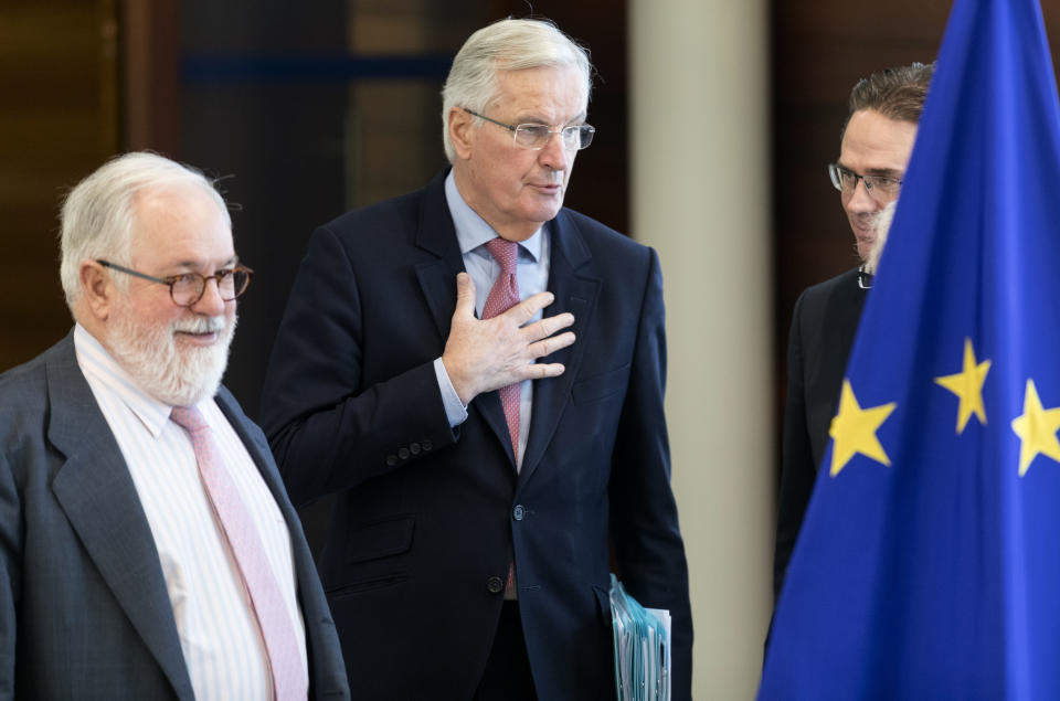 European Union chief Brexit negotiator Michel Barnier, center, arrives for a meeting of the College of Commissioners at EU headquarters in Brussels, Thursday, Nov. 22, 2018. European Commissioners met Thursday in an extraordinary session at a critical stage in Brexit negotiations, ahead of a weekend EU summit focused on Britain's departure from the bloc. (AP Photo/Thierry Monasse)