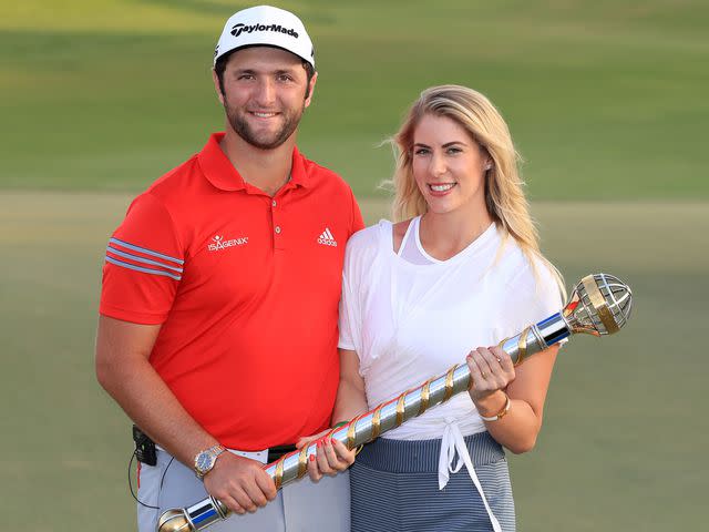 <p>Andrew Redington/Getty</p> Jon Rahm and Kelley Cahill following his victory during the final round of the DP World Tour Championship on November 19, 2017 in Dubai, United Arab Emirates.