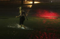 <p>A woman wades through a flooded Water St. in downtown Mobile, Ala., during Hurricane Nate, Sunday, Oct. 8, 2017, in Mobile, Ala. Hurricane Nate came ashore along Mississippi’s coast outside Biloxi early Sunday, the first hurricane to make landfall in the state since Hurricane Katrina in 2005. (Photo: Brynn Anderson/AP) </p>