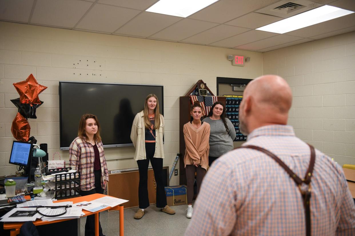 Alex Campbell stands with students in his classroom at Elizabethton High School, Thursday, April 4, 2024. In 2018, Campbell gave 20 of his students an unusual project: a cold case. Together, they were able to identify 6 Jane Does as well as the perpetrator in the case.