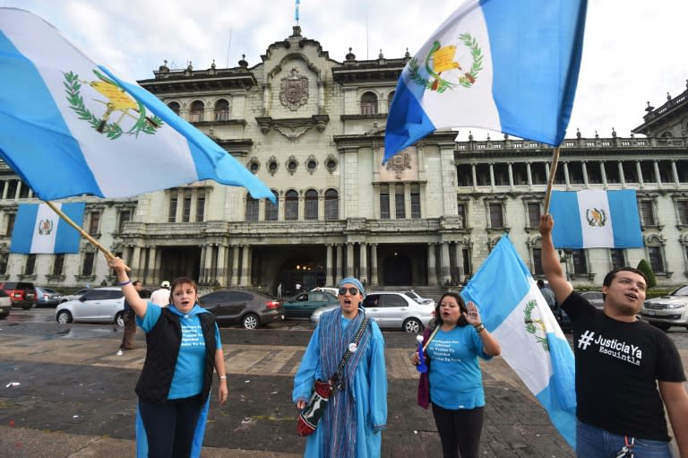 People celebrate Otto Perez's resignation during a rally outside the Presidential Palace in Guatemala City, on September 3, 2015