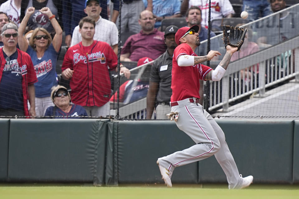 Philadelphia Phillies right fielder Nick Castellanos (8) catches Atlanta Braves Orlando Arcia's fly ball and throws the ball home in the ninth inning of a baseball game against the Atlanta Braves, Wednesday, Sept. 20, 2023, in Atlanta. (AP Photo/Brynn Anderson)