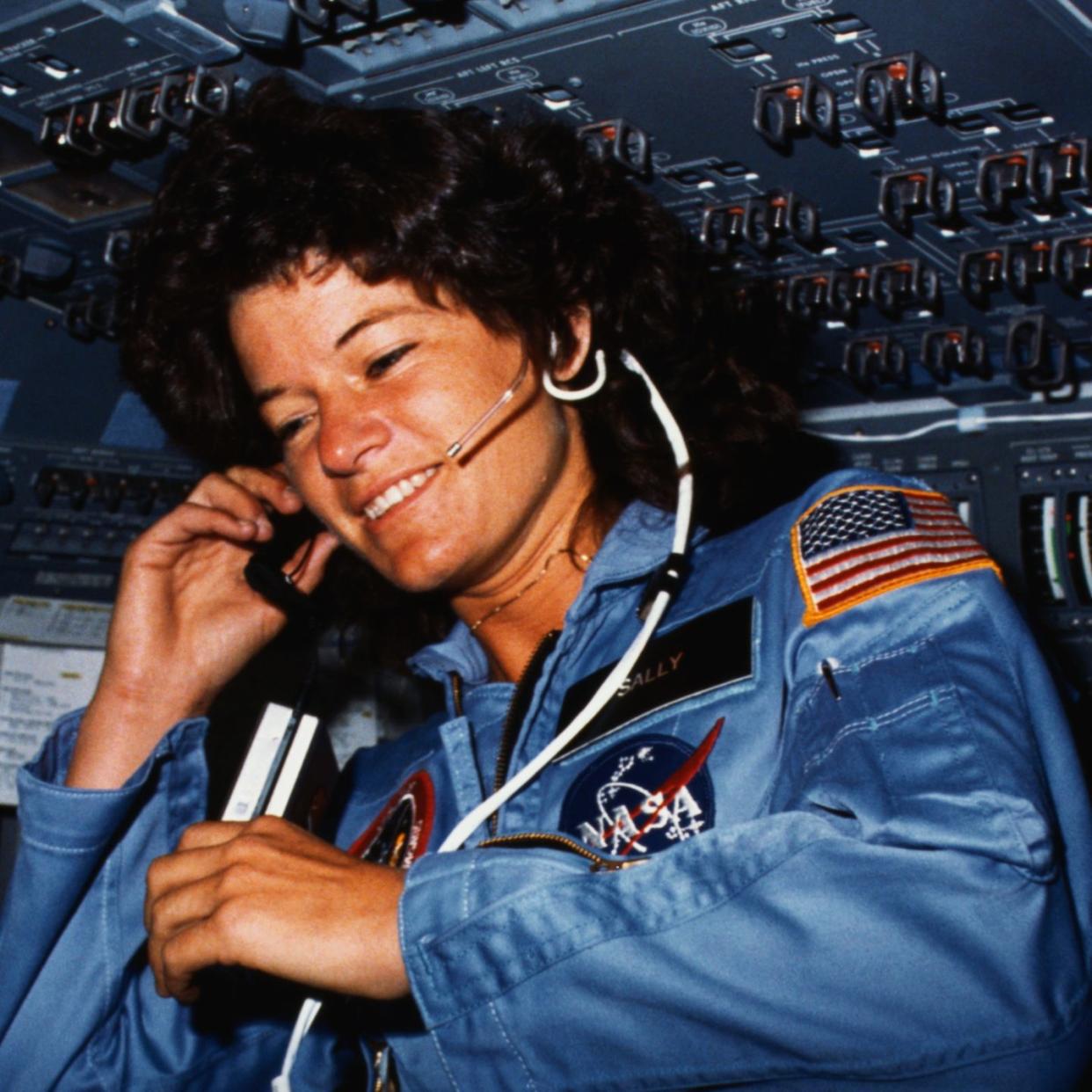 original caption johnson space center, houston, texas on board scene astronaut sally k ride, sts 7 mission specialist, communicates with ground controllers from the flight deck of the earth orbiting space shuttle challenger dr ride holds a tape recorder the photograph was taken by one of her four fellow crewmembers with a 35mm camera