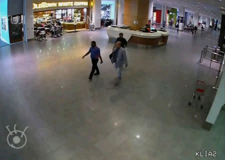 A still image from a CCTV footage appears to show security personnel escorting a man purported to be Kim Jong Nam, after the latter was accosted by a woman in a white shirt, at Kuala Lumpur International Airport. FUJITV/via Reuters TV