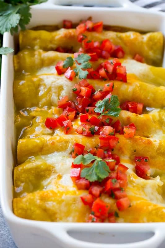 <p>Dinner at the Zoo</p><p>These enchiladas are made with shredded chicken and plenty of cheese, all rolled up in corn tortillas and smothered with green chile sauce. This enchilada recipe is sure to become a family favorite!</p><p><strong>Get the recipe: <a href="https://www.dinneratthezoo.com/green-chile-chicken-enchiladas/" rel="nofollow noopener" target="_blank" data-ylk="slk:Green Chile Chicken Enchiladas;elm:context_link;itc:0;sec:content-canvas" class="link ">Green Chile Chicken Enchiladas</a></strong></p>