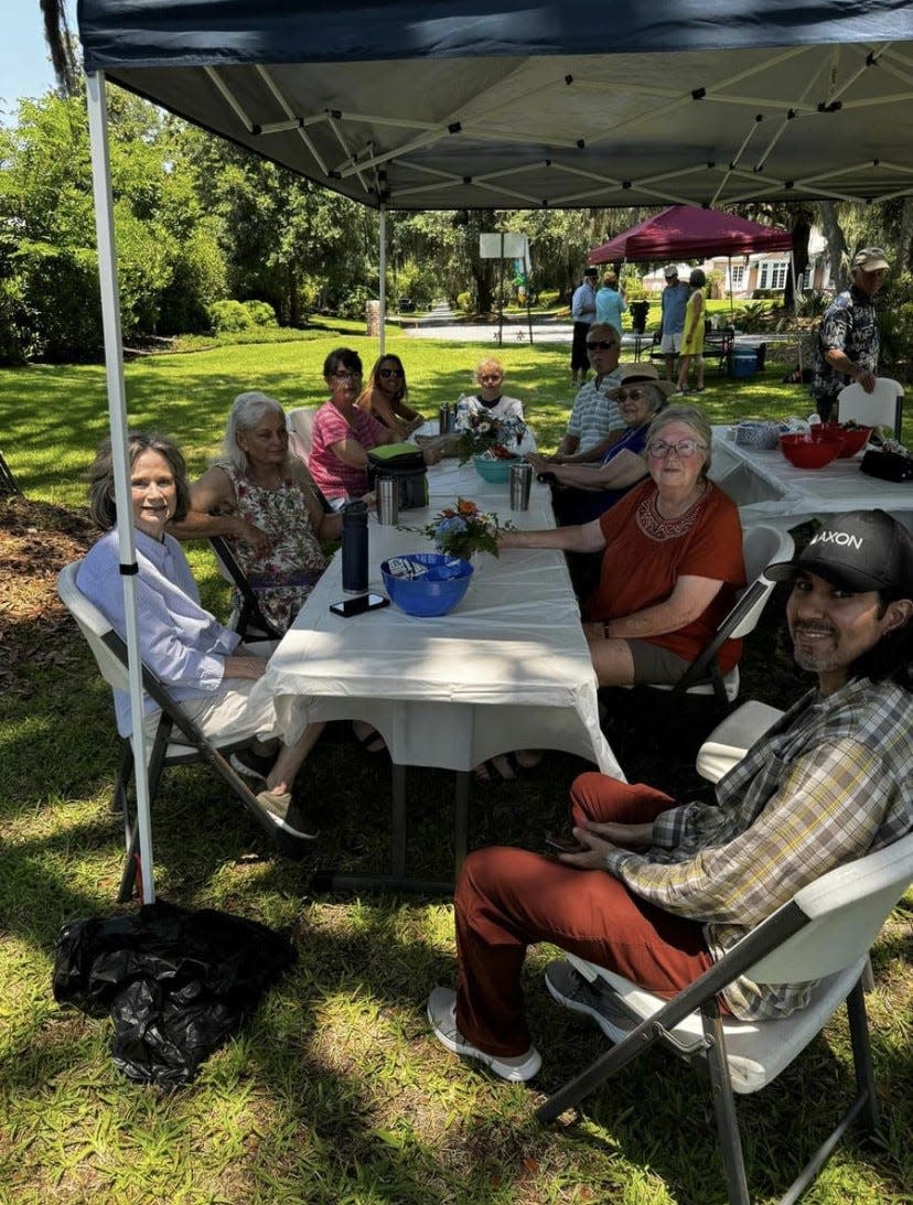 Garden Club members and Isle of Hope residents awaiting the unveiling of the plaque honoring Wymberley developer Jim Richmond.