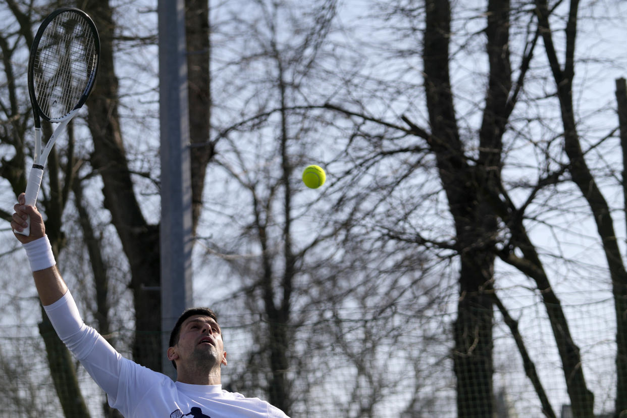 Serbian tennis player Novak Djokovic returns the ball during his open practise session in Belgrade, Serbia, Wednesday, Feb. 22, 2023. Djokovic said Wednesday he still hopes US border authorities would allow him entry to take part in two ATP Masters tennis tournaments despite being unvaccinated against the coronavirus. (AP Photo/Darko Vojinovic)